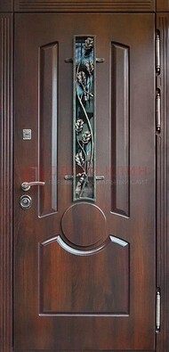 Темная железная дверь со стеклом и ковкой для кирпичного дома ДСК-136 в Дедовске