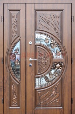 Уличная дверь в цвете Итальянский орех с виноритом и ковкой со стеклом ДВТ-147 в Красноармейске
